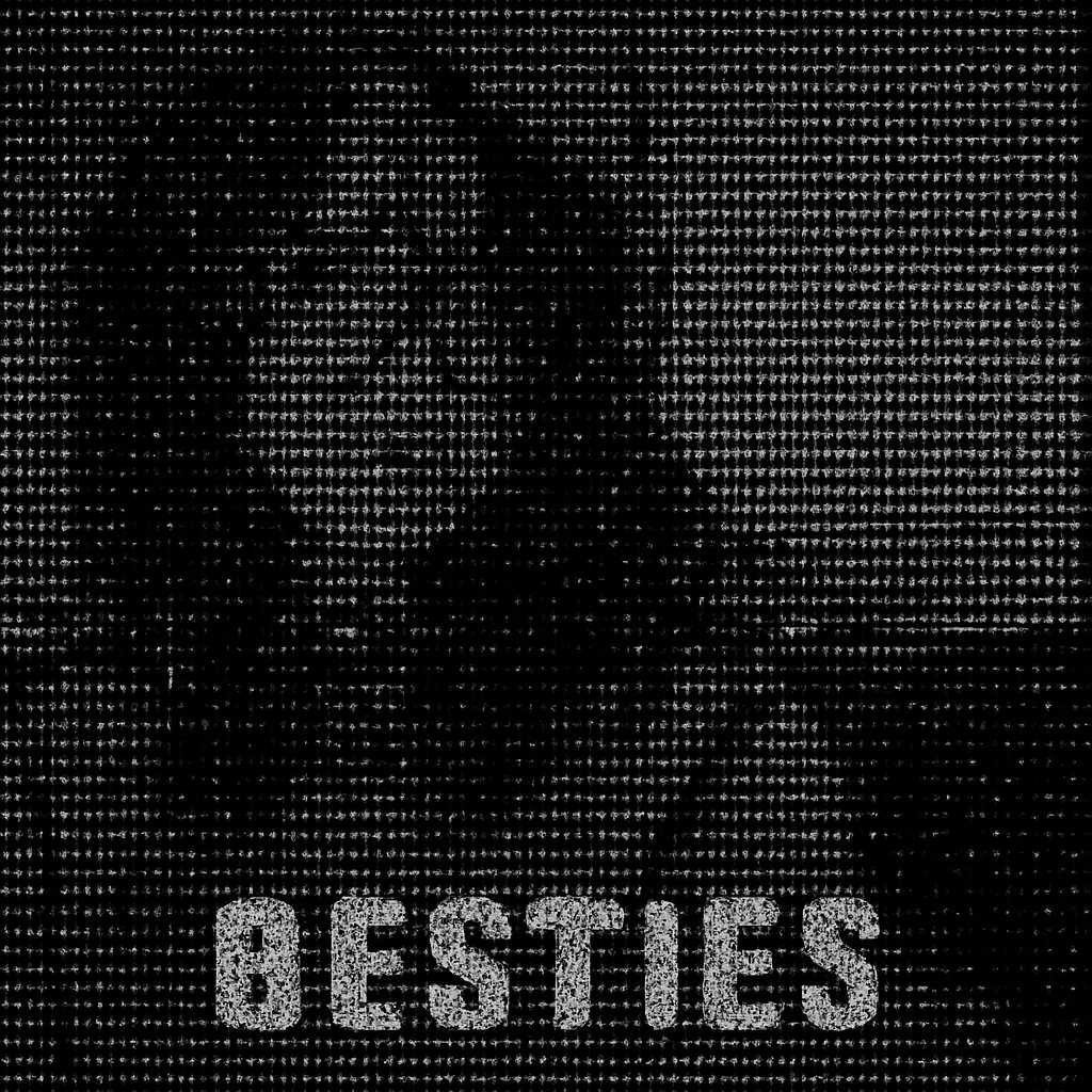 a woman with glasses sitting in front of a window