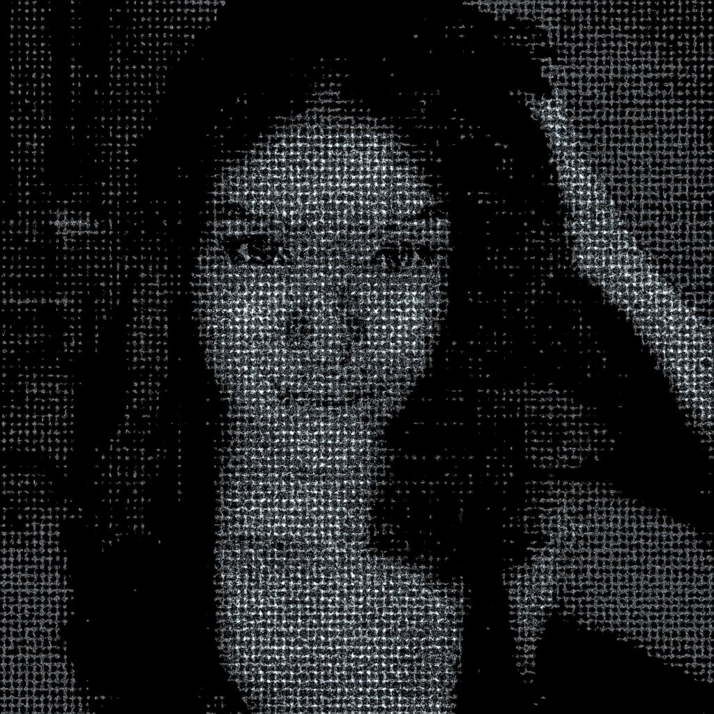 a woman with long black hair and a black tank top