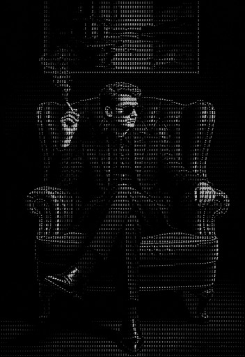 Monochrome ASCII art of a seated person in an armchair, holding a cane.