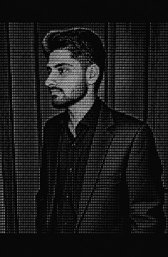 Monochrome ASCII portrait of a person wearing a jacket against a grid background.