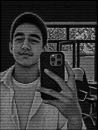 Black-and-white ASCII portrait of a person taking a mirror selfie indoors.